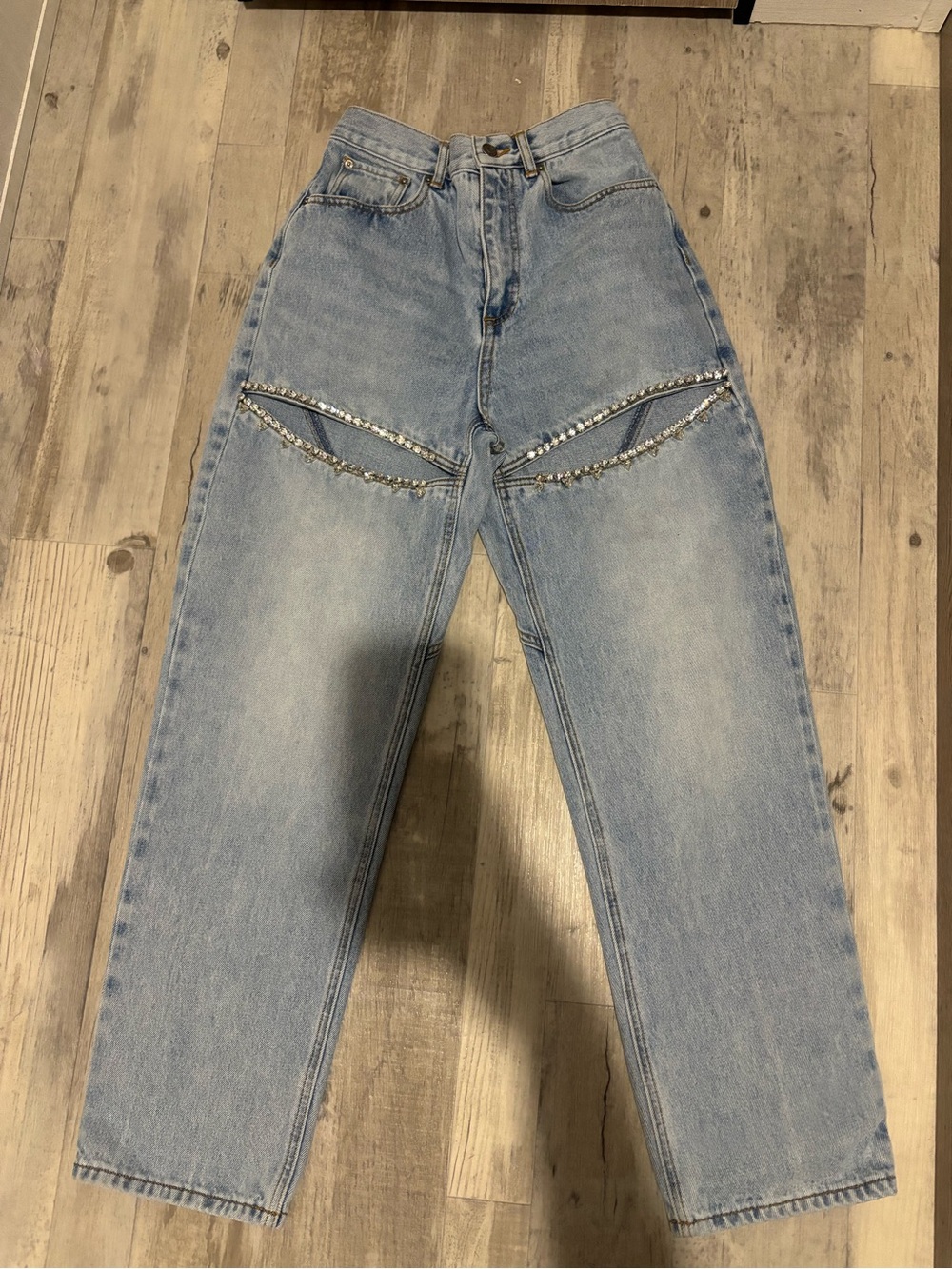 AREA Light Wash High‑Rise Jeans with Embellished Cutouts